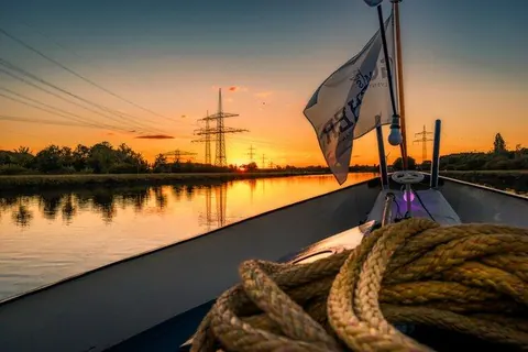 Bootsfahrt in den Sonnenuntergang – Münster-Motiv von Sascha Talke