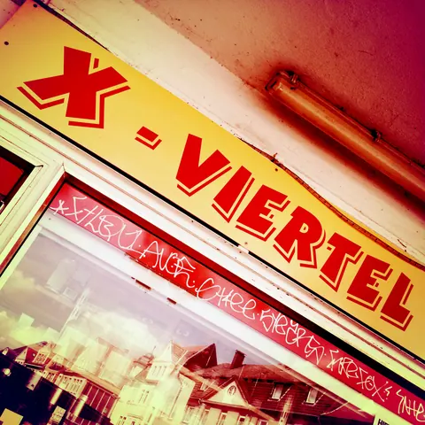 X-Viertel-Schild im Kreuzviertel – Münster-Motiv von Wolfgang Nietan